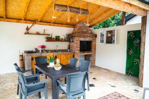 a kitchen and dining room with a table and chairs at PIK Residence in Mostar