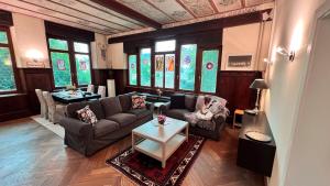 a living room with a couch and a table at Zum Hölltor in Überlingen