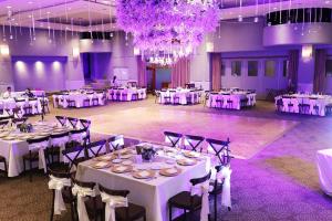 a banquet hall with white tables and chairs at Hotel Fortin Plaza in Oaxaca City +73 photos