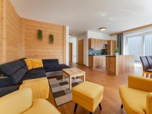 a living room with a couch and a table at Pabstin in Sankt Lambrecht