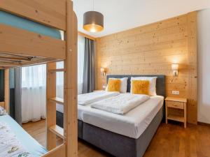 a bedroom with a bunk bed with a ladder at Pabstin in Sankt Lambrecht
