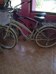 a bike parked next to a wall on a train at Sunrise Inn in Puerto Armuelles