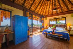 a bedroom with a bed and a wooden ceiling at Hotel Casamar Suites in Puerto Escondido +251 photos