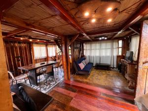 a living room with a table and a couch at Rustic Cabin in Salento in Salento +28 photos