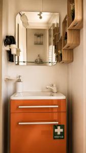 a bathroom with a sink and a mirror at Glykofilousa Tiny Ηouse in Petra