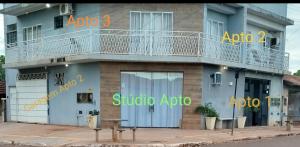 a blue building with a balcony on the side of it at Studio Apto Central próximo a Orla in Fatima do Sul