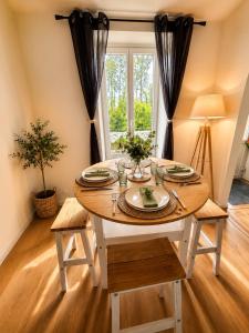 a table in a room with a table and a window at Au Morvan Voyageur in Asquins