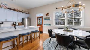 a kitchen and dining room with a table and chairs at Summer Winds Sanctuary in Cape May