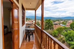 a balcony with a table and chairs and a view at Casa campo in Lamas