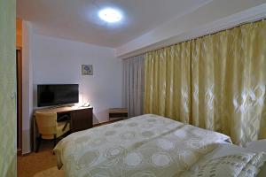 Postel nebo postele na pokoji v ubytování Hotel Šariš