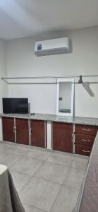 an empty room with a counter top in a room at Studio Central in Campo Grande +6 photos