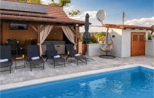 a patio with a swimming pool and a house at Stunning Home In Kutina With Sauna in Kutina