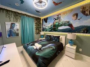 a bedroom with a bed with a painting on the wall at 5BR Getaway with Pool Arcade Games and Resort Access in Davenport