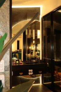 a mirror on a wall in a living room at On Eagle Wings Mountain Retreat & Spa in Neranwood