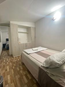 a small bedroom with a bed in a room at Doña Nelly in Asunción