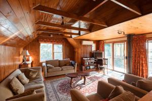 a living room with a couch and a table at Possum Ridge in Muston