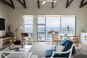 a living room with a view of the ocean at The Jetty, Port Willunga in Port Willunga