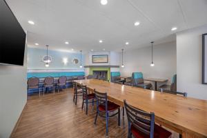 a large room with a long table and chairs at Best Western Plus Ocean View Resort in Seaside +56 photos