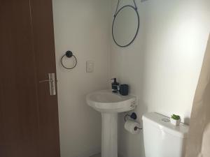 a bathroom with a sink and a mirror on the wall at Refugio Don Rogelio in Minas +10 photos