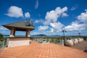 a gazebo with a sign on top of it at The View Rawada Phuket in Rawai Beach