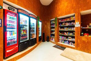 a store with two refrigerators in a grocery store at GRU Residence by Housi in Guarulhos