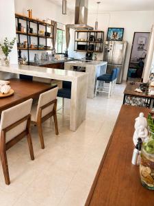 a kitchen with a large table and chairs in it at Casa Mayi Private house with pool in Chablekal in Chablekal