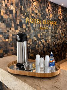 a coffee maker on a tray on a counter at Hotel Elevare Niteroi in Niterói