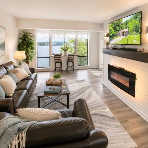 a living room with a couch and a fireplace at Tranquil Retreat - Close to everything you need in Osage Beach