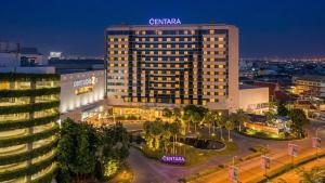 a large building with a sign on top of it at Centara Udon in Udon Thani