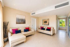 a living room with two couches and a couch at Special offer! Villa Bueno with private pool&beach in Punta Cana