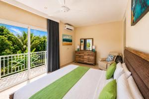 a bedroom with a large bed and a large window at Special offer! Villa Bueno with private pool&beach in Punta Cana