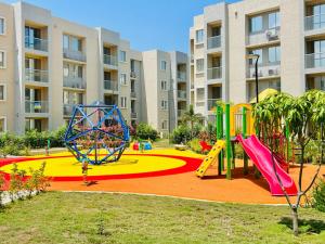 a playground in a apartment complex with a play area at Capriela Serena del Mar in Cartagena de Indias