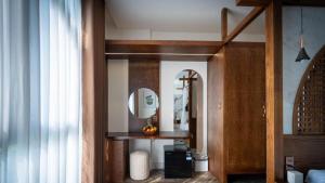 a room with a mirror and a dressing table at Cactus Villa in Dong Hoi +53 photos