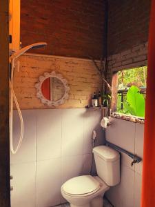 a bathroom with a toilet and a window at Mộc Lan’s House in Phi Liêng +89 photos