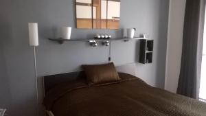 A bed or beds in a room at Apartmán Terchová