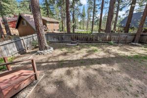 a backyard with a wooden fence and a wooden bench at 838 Placer Avenue home in South Lake Tahoe
