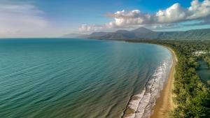 an aerial view of the shoreline of a beach at Freestyle Resort Port Douglas in Port Douglas