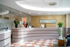 a lobby with a reception counter in a building at Alloggi Liviana Pontecorvo in Padova