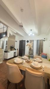 a dining room with a table and some chairs at Mellow Place Staycation in Naic +21 photos