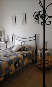 a bedroom with a bed and a lamp in it at Appartamento Piazza Buzi in Orvieto