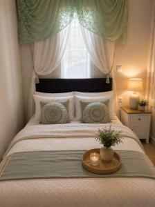 a bedroom with a bed with a window at Pantanassa House in Nisaki