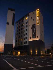 a building with a sign on the side of it at Gwangju The IN Hotel in Gwangju