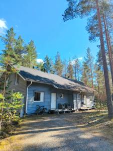 a house in the middle of a forest at Mökki Jyrkinkuja in Loimaa