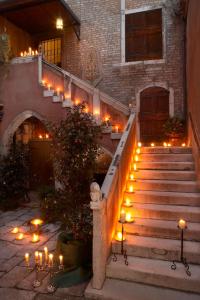 a set of stairs with candles in front of a building at Appartamento Corte Gotica in Venice