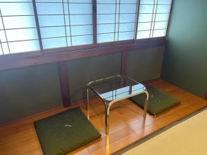 an empty room with a bench and a window at TAKIBEst Bnb&Bar in Takibe +20 photos