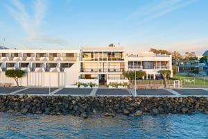 a rendering of a building by the water at Bay Breeze Boutique Accommodation in Batemans Bay
