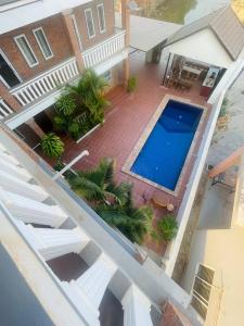 an overhead view of a swimming pool in front of a house at Monterey Angkor Boutique in Phum Pobos