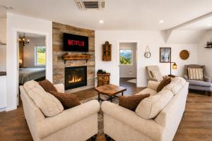 a living room with two couches and a fireplace at Berg Haus Home in Leavenworth