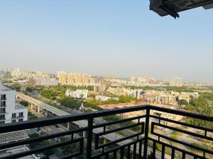 a view of a city from a balcony at Apex Hub in Greater Noida