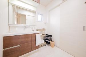 a bathroom with a sink and a mirror at Halema in Ichinomiya +61 photos